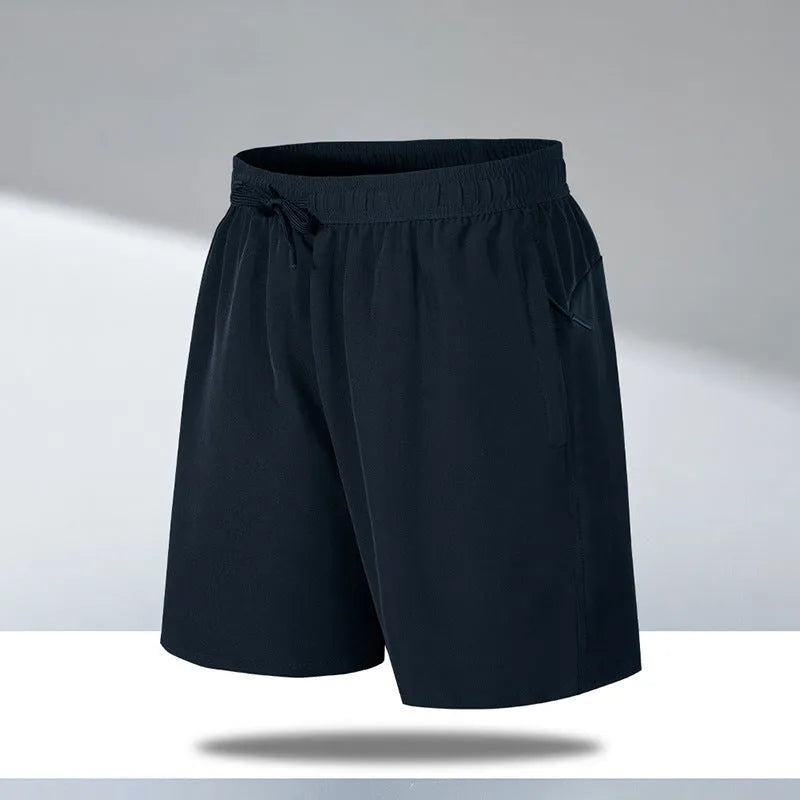 Man wearing loose black quick-dry sports shorts with an elastic waistband