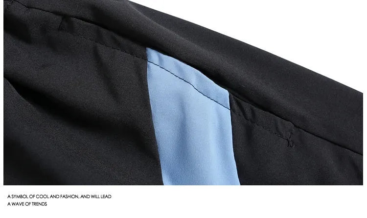 Man wearing loose black quick-drying sports shorts with an elastic waist for training.