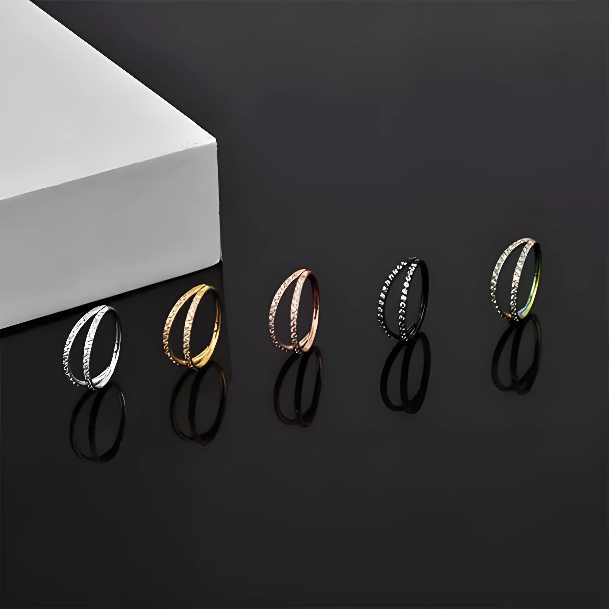 G23 titanium alloy lip and nose ring body jewellery with a zircon stud in gold or steel colour.
