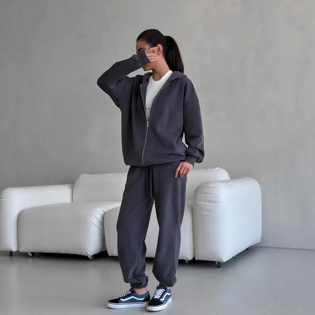 Street style loose-fit two-piece set with long-sleeved coat and trousers in grey.