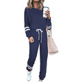 Women's plus size casual suit set in loose-fitting design with half-sleeve top and solid colour trousers