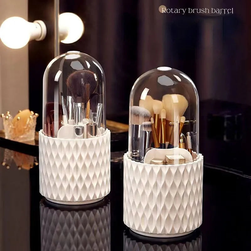 White acrylic rotating makeup brush holder with transparent dust cover on desktop