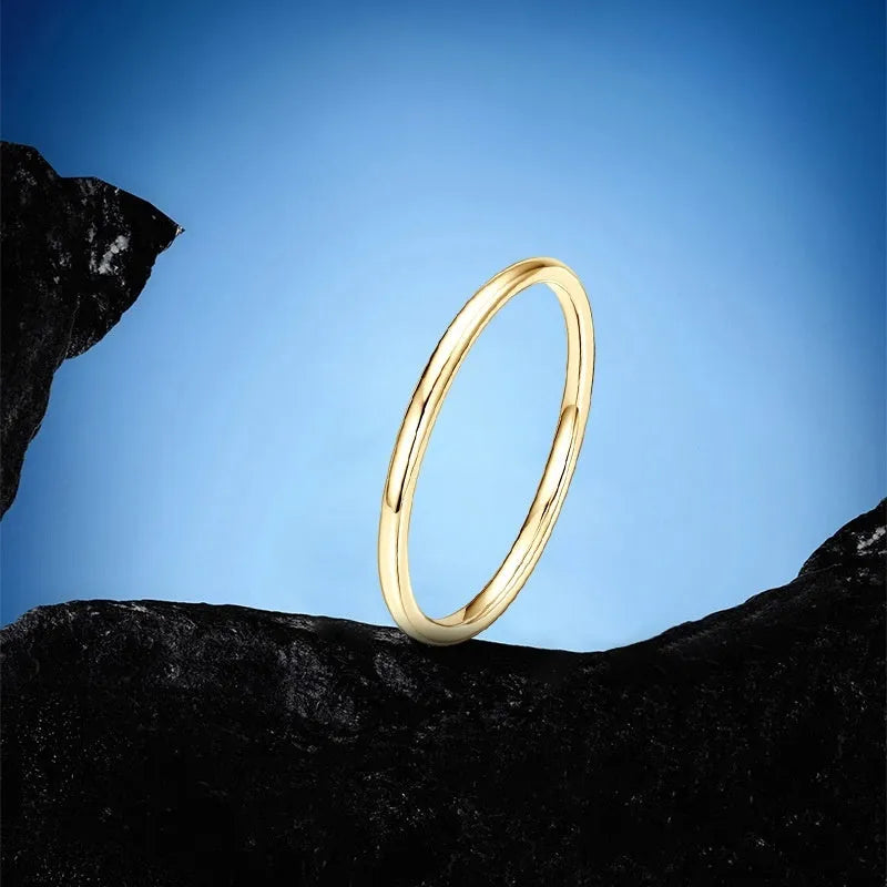 Geometric sterling silver bracelet ring with round detail on a size chart background.
