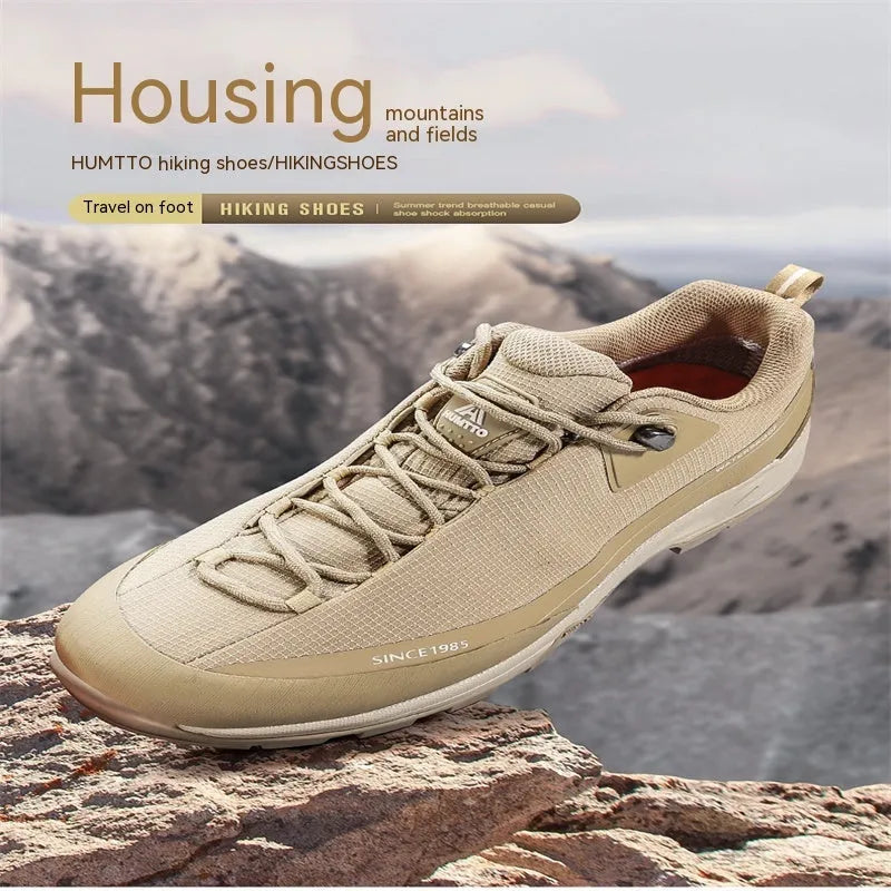 Men's low-top mountain climbing shoes in black with non-slip rubber outsole and lace-up design