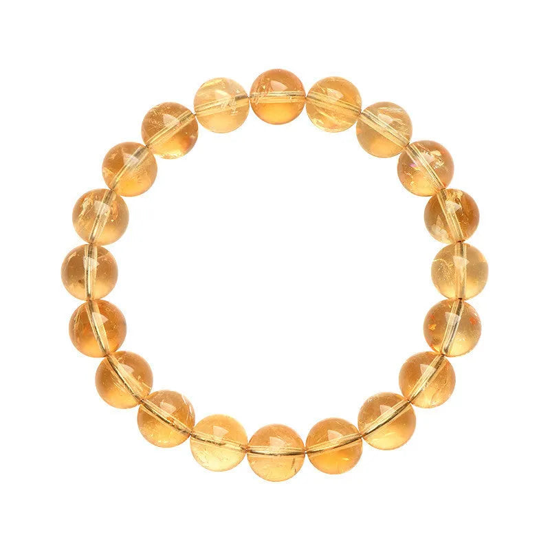 Natural yellow citrine gemstone bead bracelet showing geometrical beads on a string.