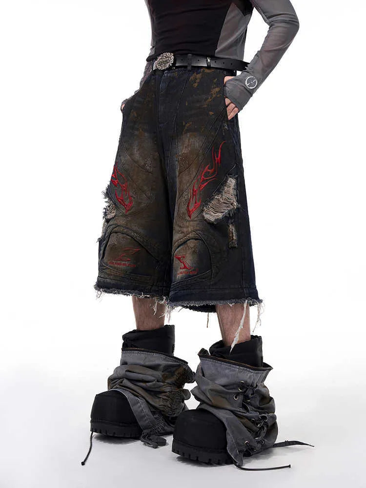 Men's retro jeans with detachable trouser legs in denim, shown in loose wide-leg fit.