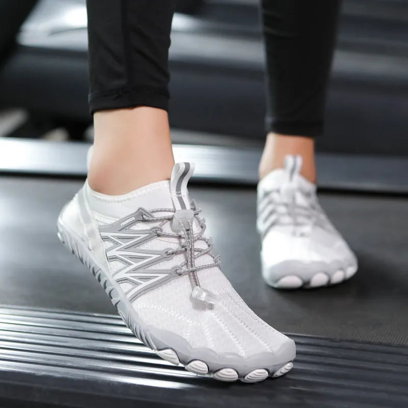Indoor fitness training sneakers in multiple colours with striped pattern and rubber sole.