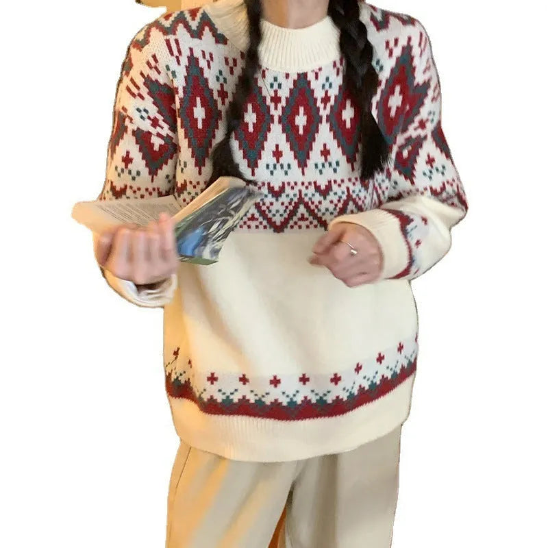 Red and white striped loose fit pullover knitted top with long sleeves on a mannequin.