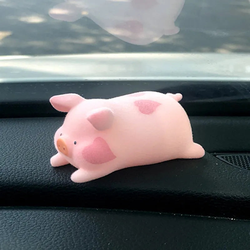 Cute cartoon pig resin figurine designed as a car dashboard decoration accessory.