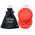 Orange natural rubber golf centre of gravity training mat on practice surface