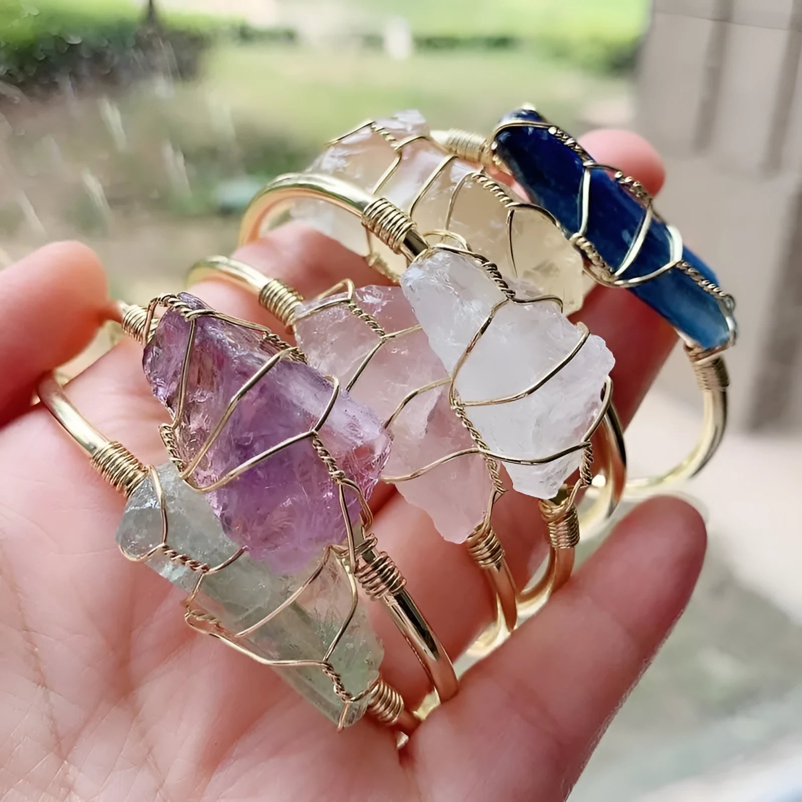 Natural crystal rough stone bracelet with gold winding metal accents in geometric bohemian style