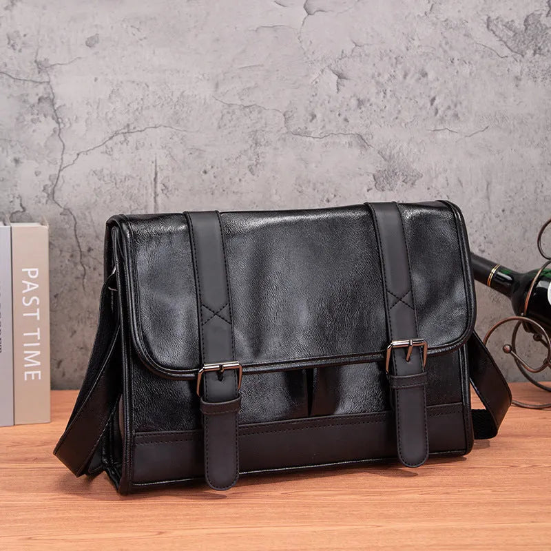 Black Korean style men's anti-theft backpack made from PU leather with visible sewing thread detailing.