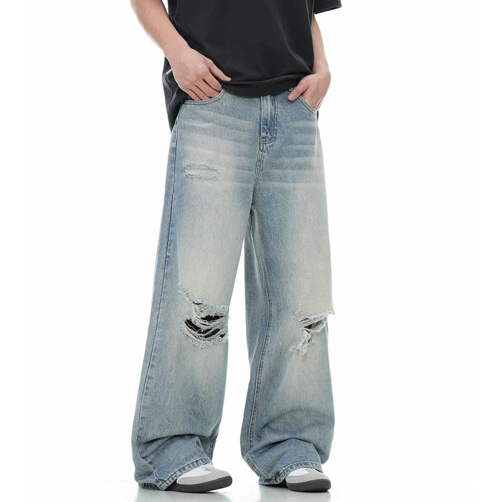 Men's blue straight-leg ripped jeans with zipper fly and retro styling in cotton blend fabric