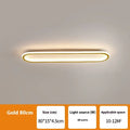 Minimalist black strip ceiling lamp with aluminium body and PVC shade mounted on a white ceiling.