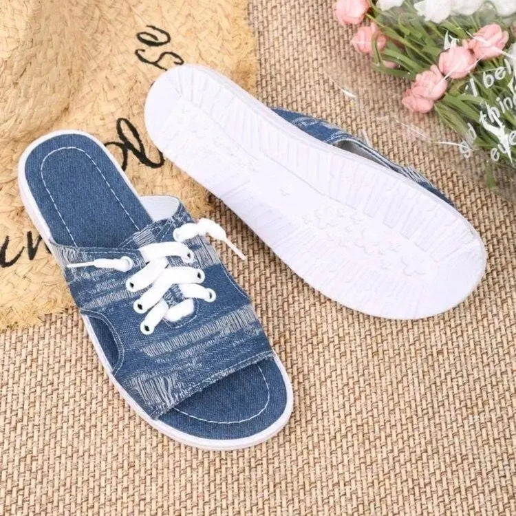 Blue Roman style women's canvas slippers with flat design and rubber sole