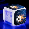 Square plastic alarm clock with football pattern design showing four alarm settings and USB charging port
