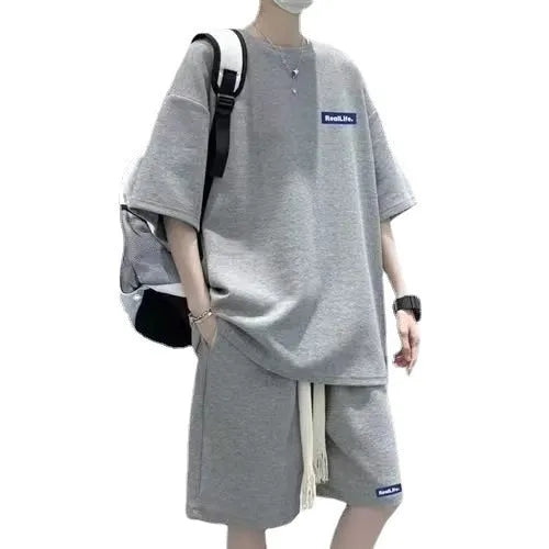 Waffle leisure sports suit consisting of short sleeve top and matching shorts in polyester cotton fabric