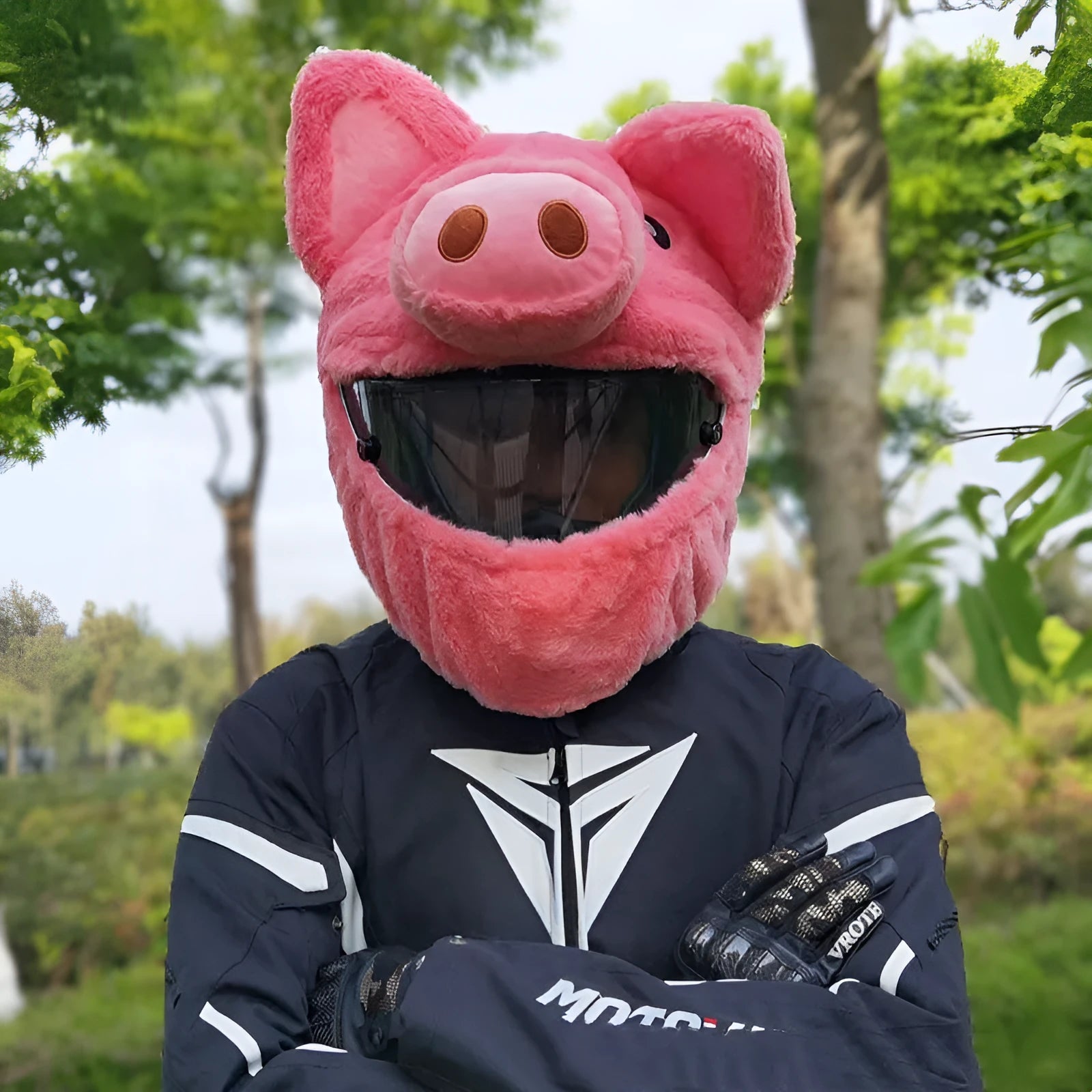 Pink plush cartoon-style protective hood for helmets on a white background.