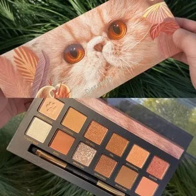 Twelve-colour animal eye shadow plate showing seven wild animal designs including golden tiger and leopard patterns
