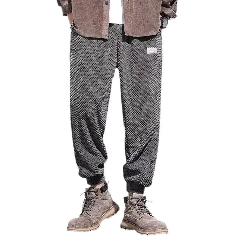 Grey men's straight-leg sweatpants with an ankle tie fastening on the hem.