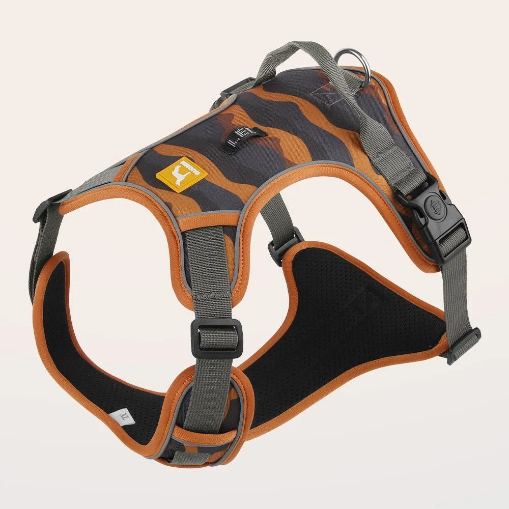 Orange reflective dog chest and back harness with an attached hand-holding rope on a grey background.