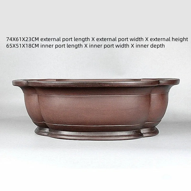 Handmade large purple clay crabapple-shaped flower pot measuring 74cm by 61cm.