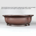 Handmade large purple clay crabapple-shaped flower pot measuring 74cm by 61cm.