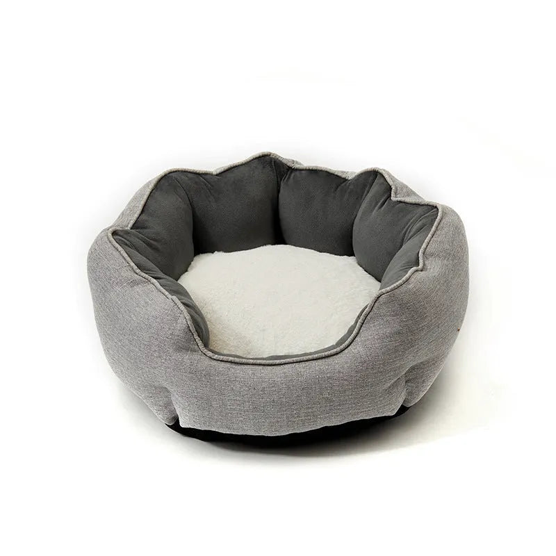 Blue octagonal pet sofa bed with a removable central mat for a small dog or cat.