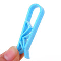 PP plastic non-slip clip for fixing a bin bag to the side of a rubbish can.