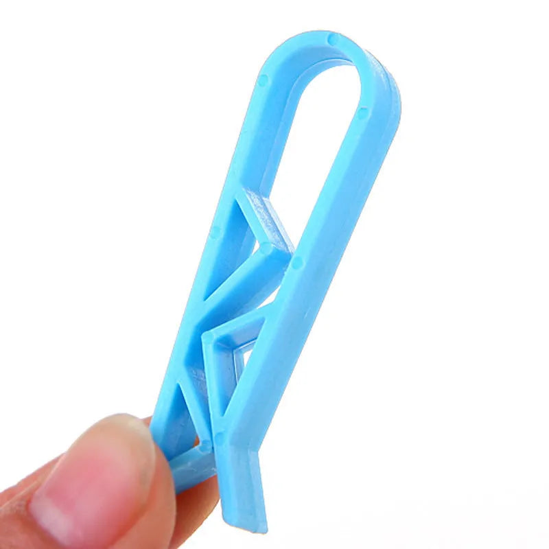 PP plastic non-slip clip for fixing a bin bag to the side of a rubbish can.