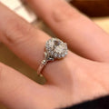 Silver geometric bridal bouquet ring with adjustable opening on index finger