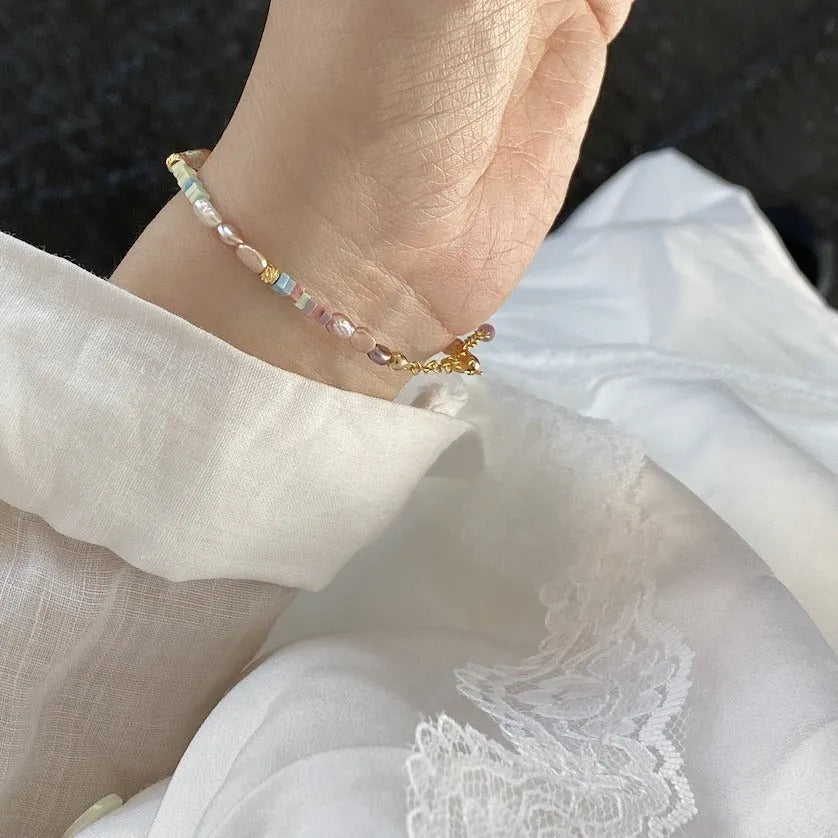 Natural pearl bracelet and necklace set with purple silver beads and 14K gilded accents in irregular U-shaped design