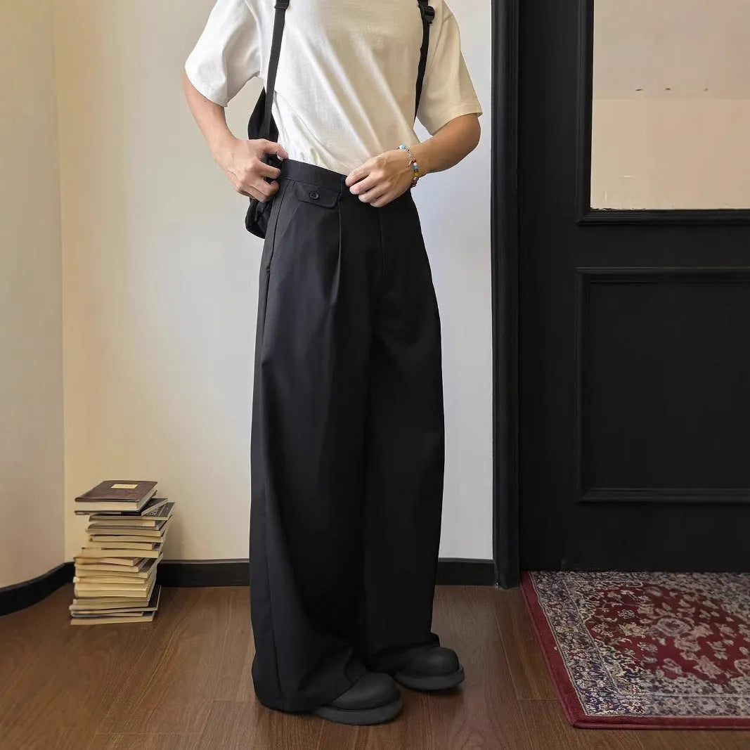 Men's brown straight-leg casual trousers with wide-leg drape fit on hanger