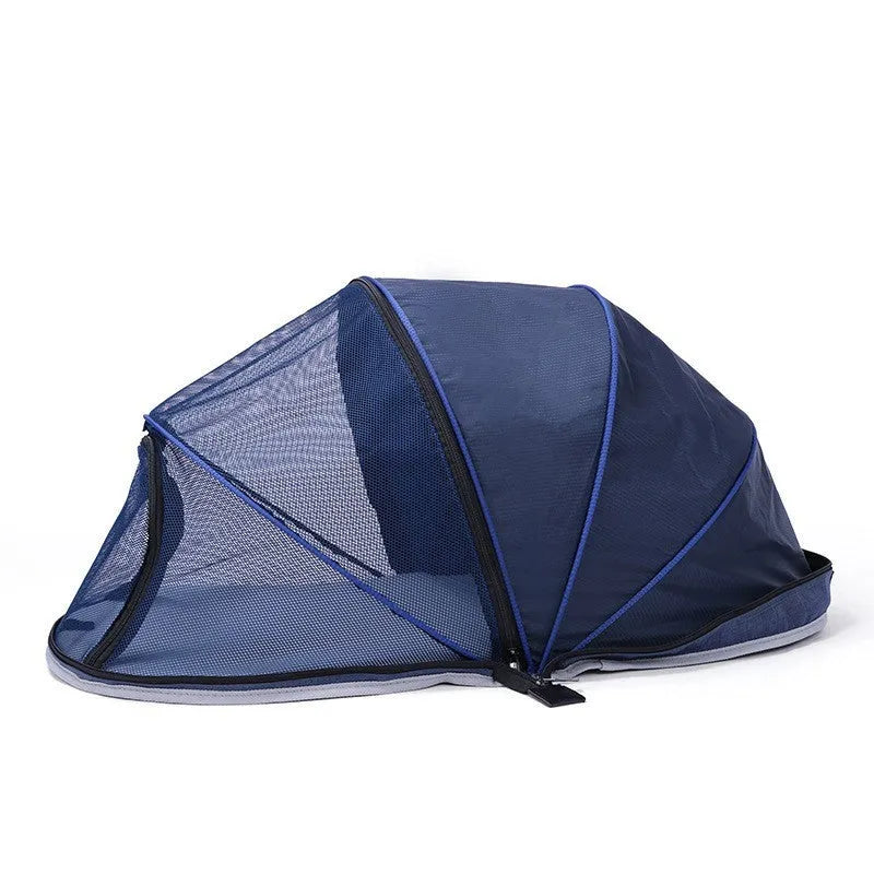 Black half mesh cat folding tent folded for storage with mesh ventilation panels visible