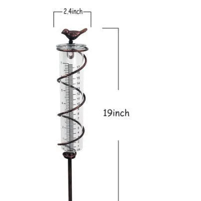 Cast iron garden hyetometer with glass rain gauge showing hummingbird design and measurement scale