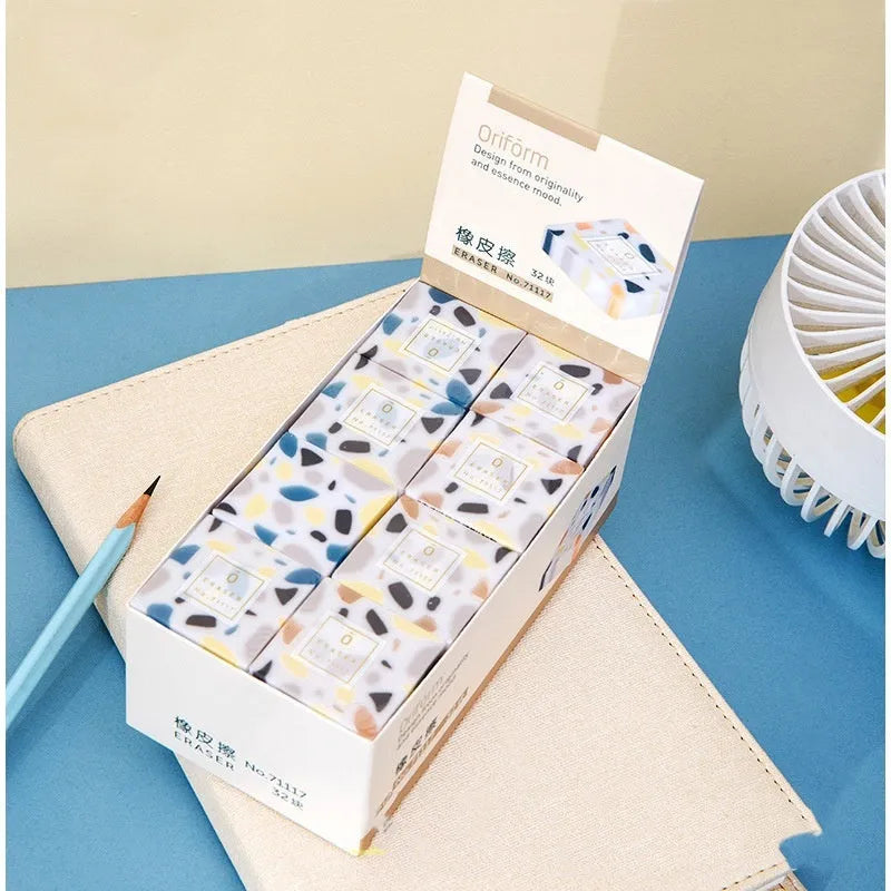 White brick-shaped rubber eraser for pencil marks with Super Clean Traceless branding