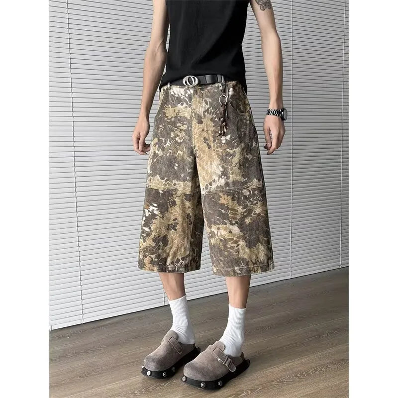 Women's yellow snake camouflage print cropped jeans on a model.