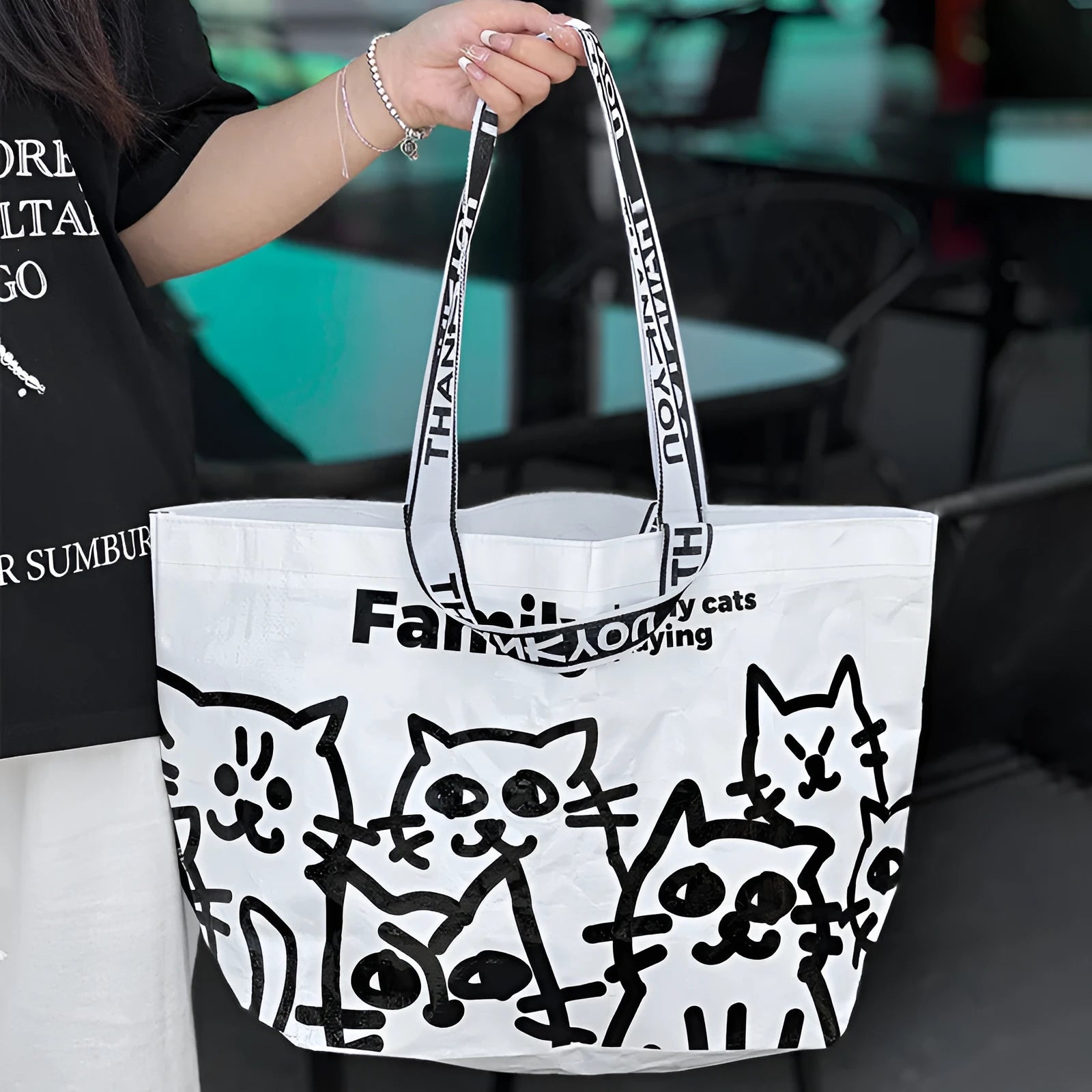 A blue waterproof woven handbag made from PP material with a colour printed pattern.
