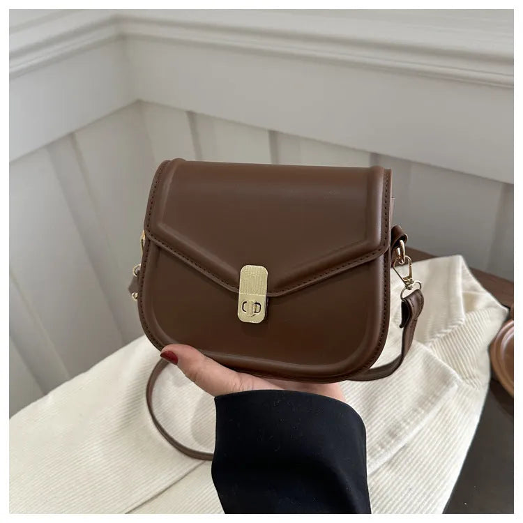 Soft textured PU leather messenger bag with clamshell opening, shown in a horizontal square shape.