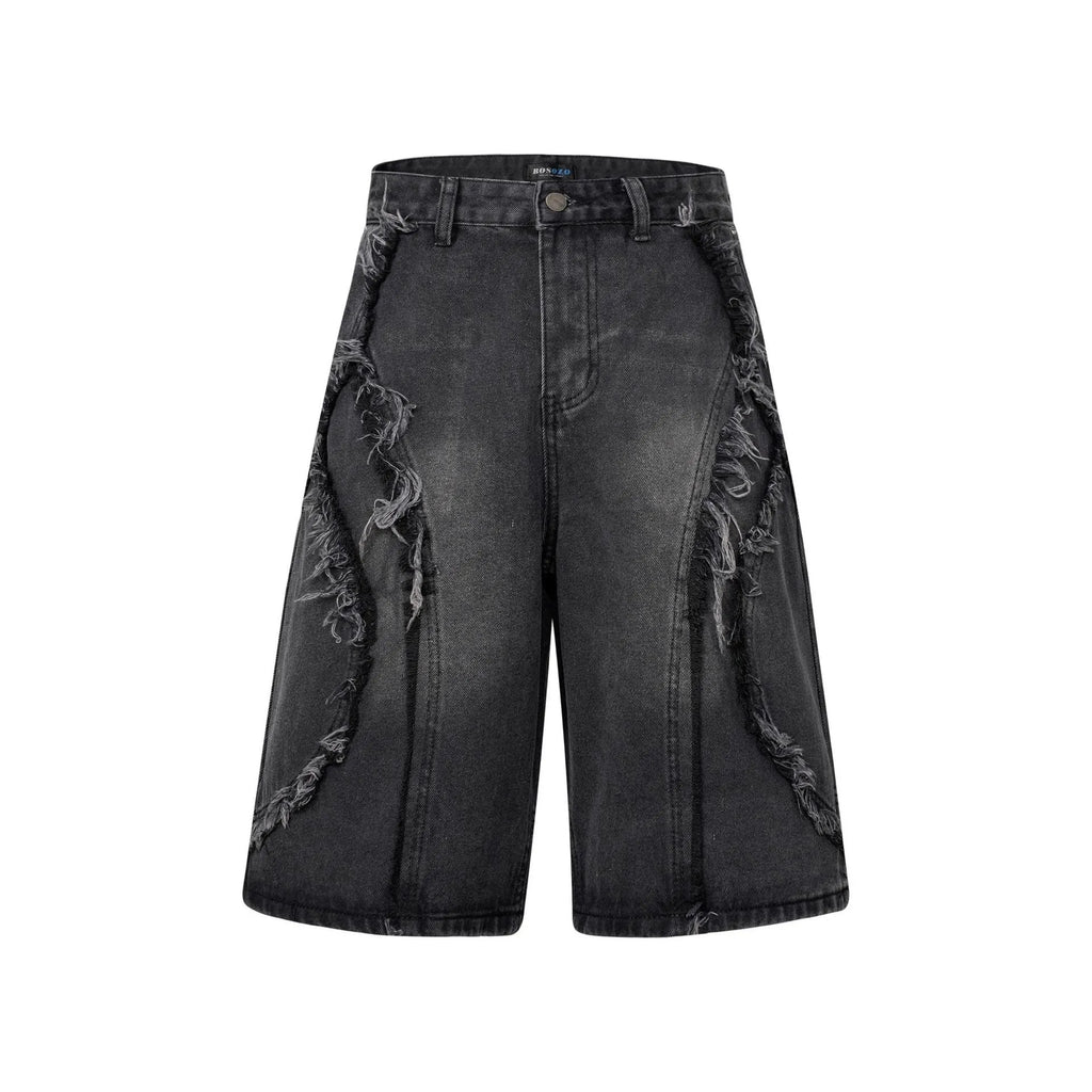 Distressed denim shorts with raw edge hem in light blue, laid flat to show straight leg cut.