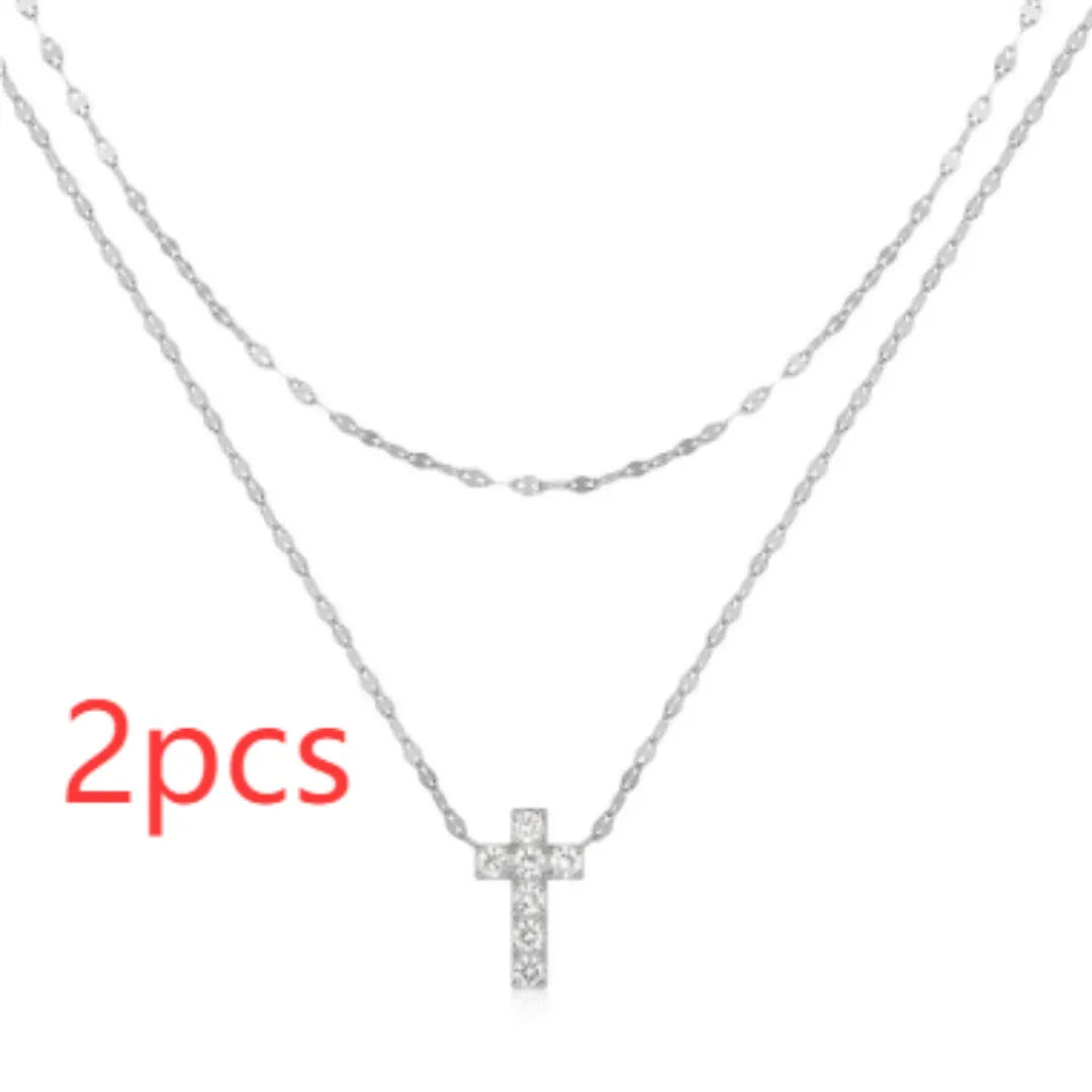 S925 Sterling Silver necklace with a geometric double-layer cross pendant featuring twin diamond detailing.