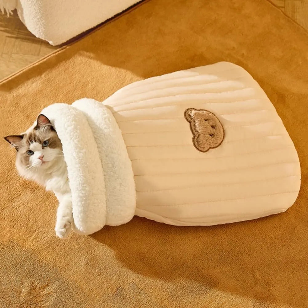 Cat sleeping bag in blue plush fabric with semi-enclosed tunnel design for indoor cats