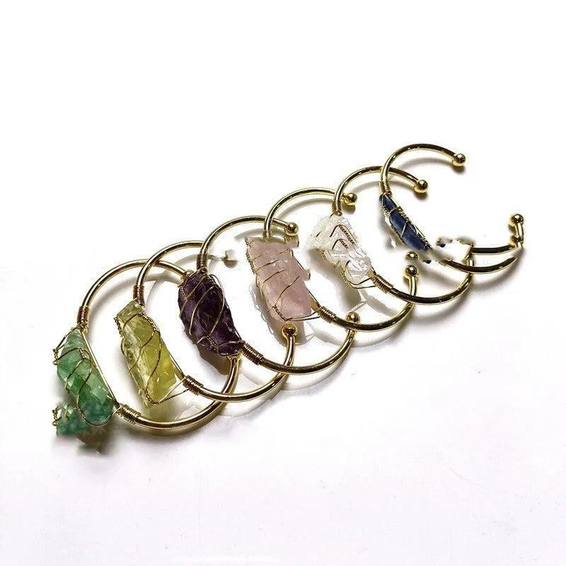 Natural crystal rough stone bracelet with gold winding metal accents in geometric bohemian style
