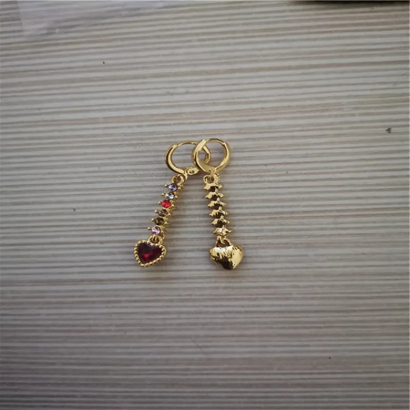 Women's heart-shaped alloy earrings with a shiny electroplated finish in gold and silver colours.