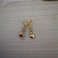 Women's heart-shaped alloy earrings with a shiny electroplated finish in gold and silver colours.