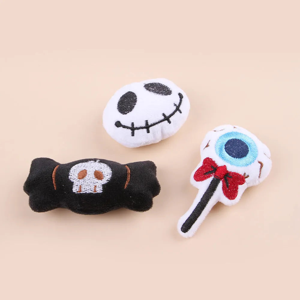 Small plush cat teaser toy with candy and skull designs in eyes or candy colours