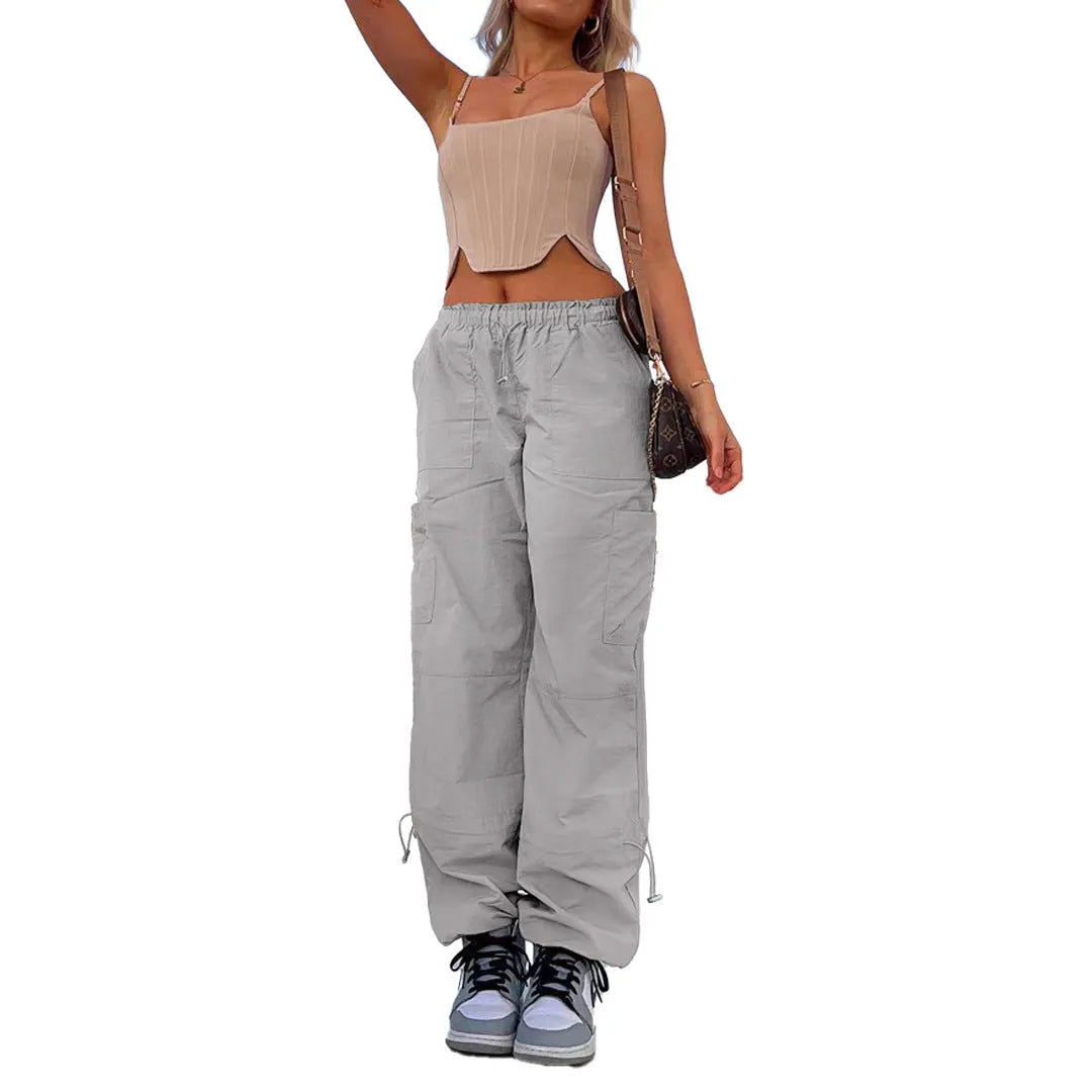 Straight-leg loose fit cargo casual pants in grey with multiple pockets, made from polyester fabric.
