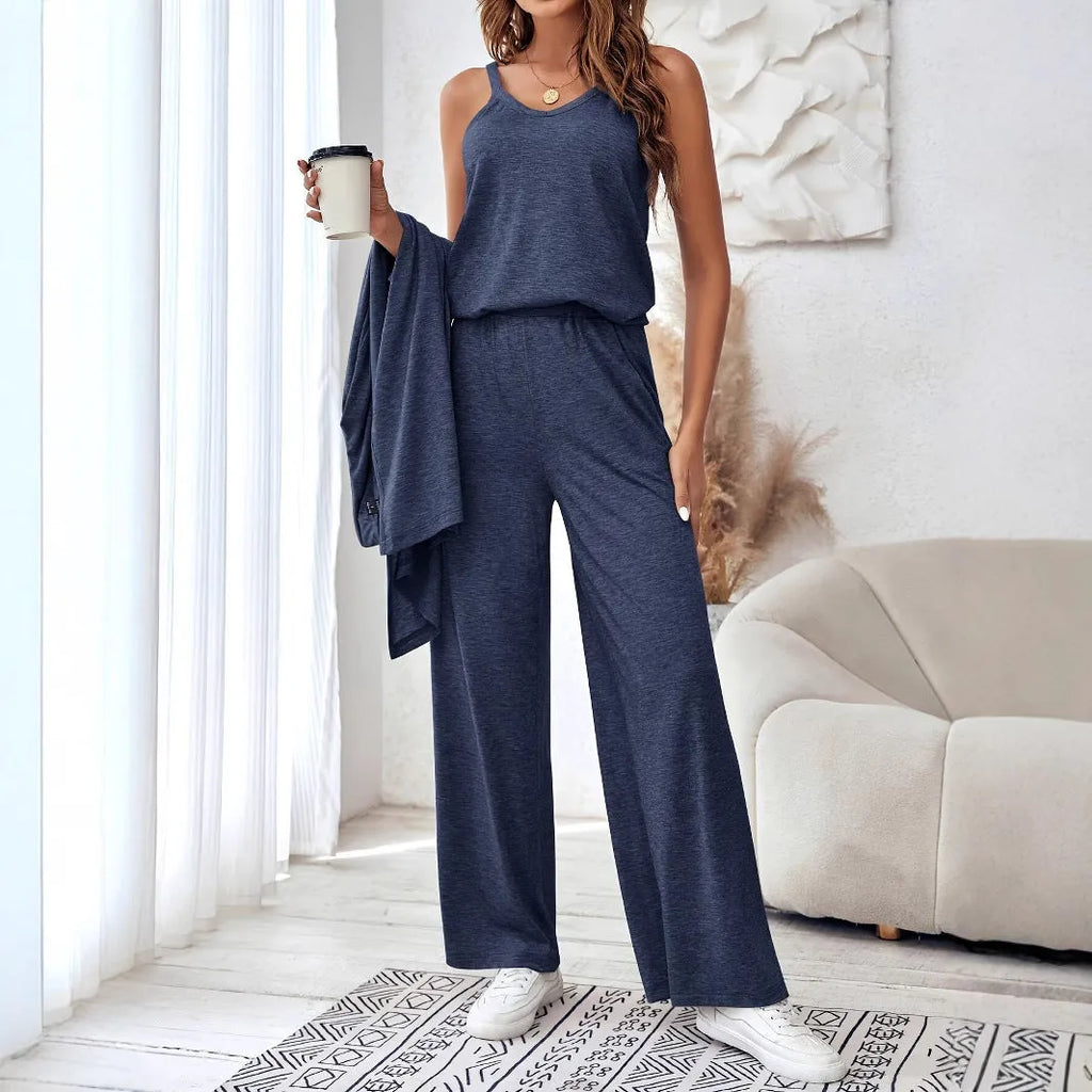 Blue women's two piece casual suit with long sleeve top, trousers, and suspenders on a hanger.