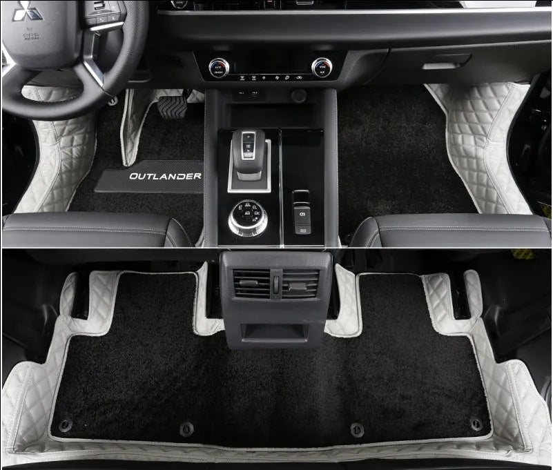 Custom black PU floor mats fitted in a Mitsubishi Outlander footwell.