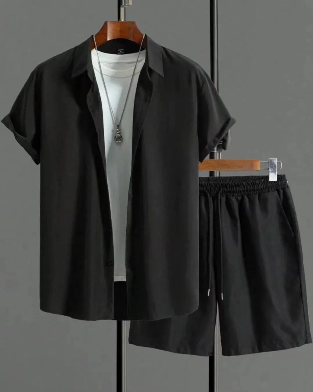 Men's jacquard short sleeve suit set in black with matching shorts, showing front view